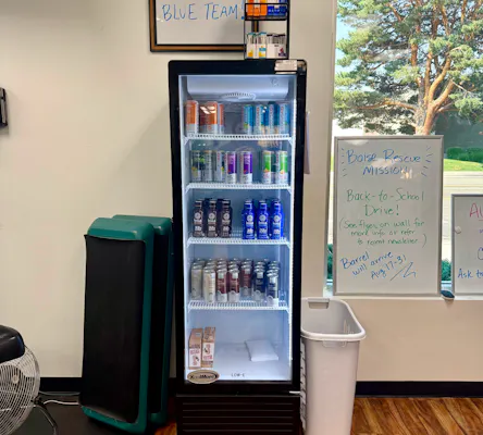 Beverage cooler stocked with drinks.