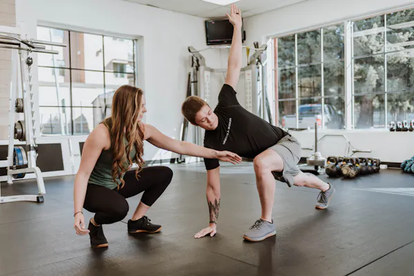 Melissa training client on world's greatest stretch.